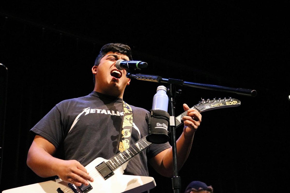 Senior Sully Nguyen sings the song "Animal" by Neon Trees, alongside senior Alex Irwin. Nguyen founded the Guitar Club and has slowly been recruiting new members. His guitar journey started in 2020 when the COVID-19 pandemic hit and everything was shut down. "I just figured I'd pick it up since we were stuck inside," Nguyen said. Although he prefers playing the guitar, Nguyen has taken singing classes the past two years at WHS and sang most of his life. "I'm really excited to see where this club will go after I graduate," Nguyen said.