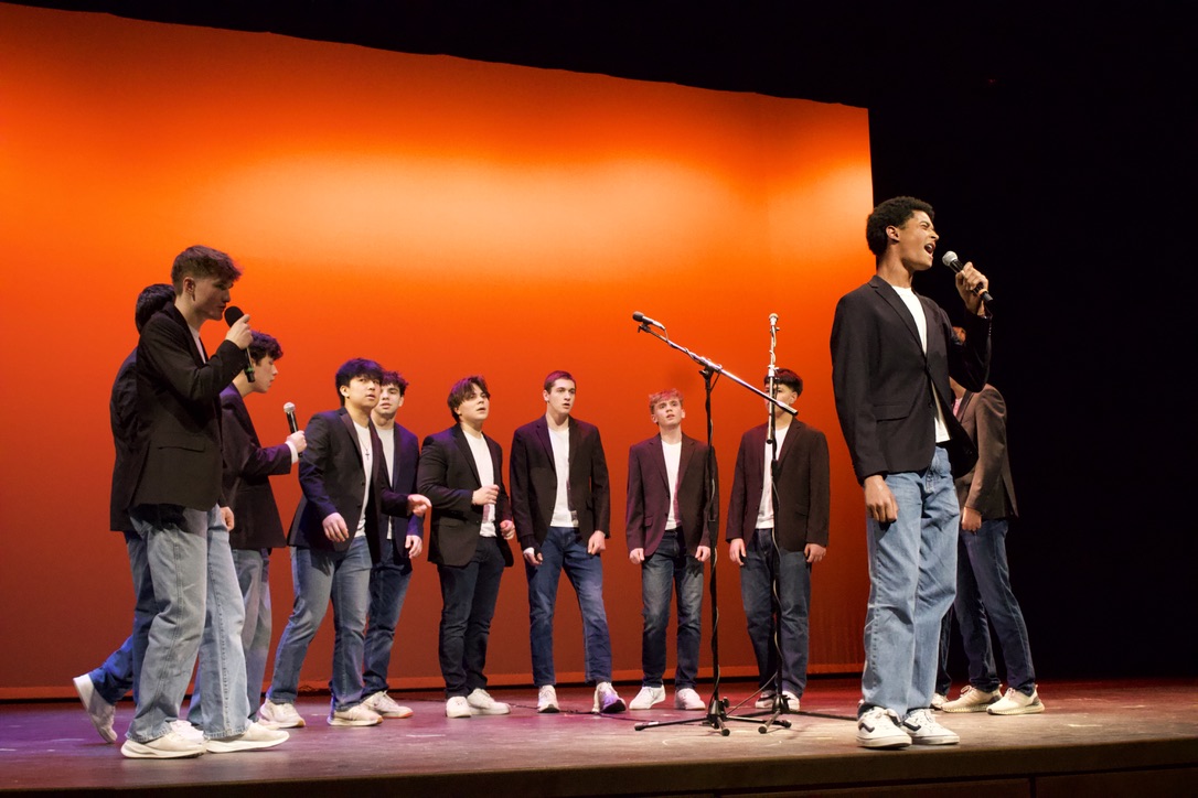 Soloing the second song performed by the T-Tones, junior Benjamin Hammond sings "Amazing," originally performed by Rex Orange Country.