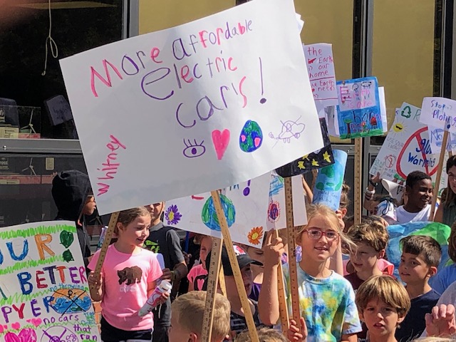 Happy Hollow students advocate for climate action in June 2019. Around this time, the idea to introduce solar panels to the elementary schools was brought to the Wayland Town Council’s attention. “In the past, the town hasdused Ameresco solar panels for the Wayland Middle School and Wayland High School,” Happy Hollow students Ruth Flacke, Kiera Hines, Jared Kerrigan and William Bargoot said in the Happy Hollow Petition letter for solar panels to the Wayland Town Council on June 24, 2019. "Now we think it’s our turn. We love our school and we love our earth, we want to protect it.”
