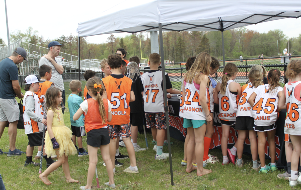 At this years "W Day," young lacrosse players gather around to meet professional lacrosse players who visited the fields on Sunday, May 4.