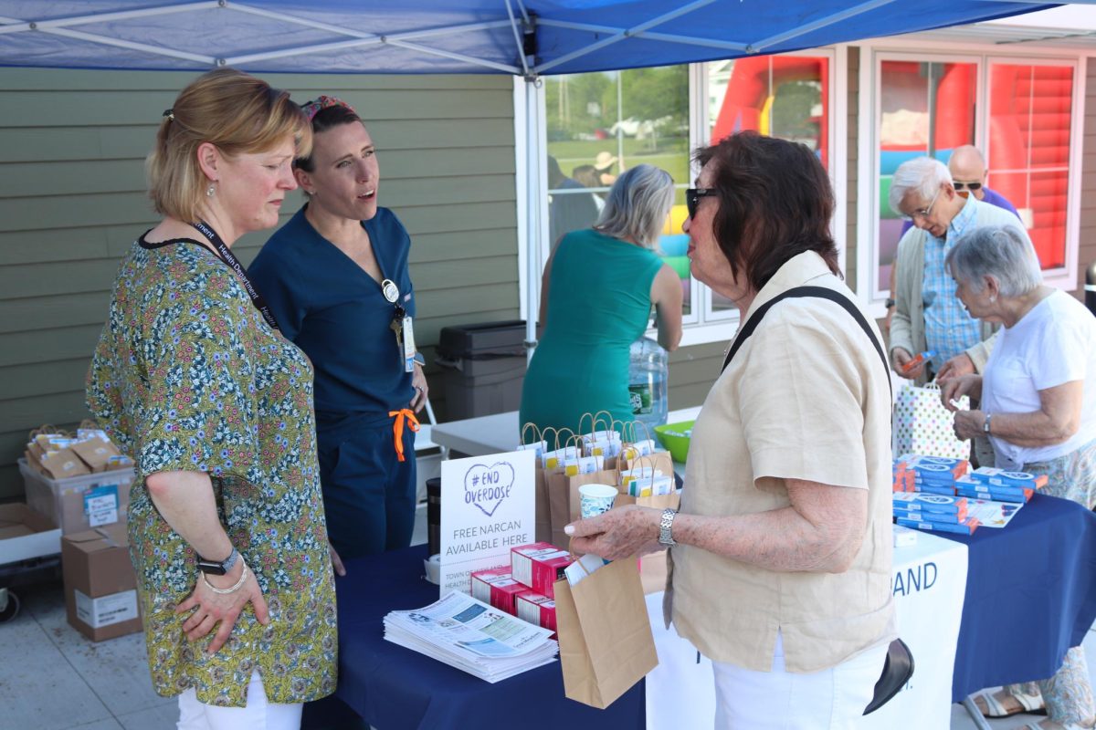 Representatives from Wayland Cares hand out goodie bags and Narcan to spread awareness about overdoses.