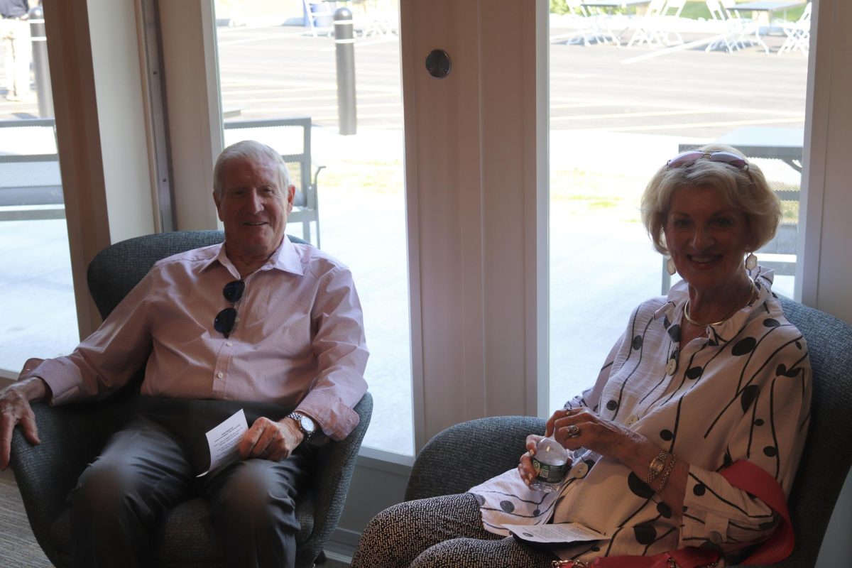 Volunteer Pauline Hoagland and her husband Deacon Hoagland attend the event. The Hoaglands are pictured sitting in one of the main common areas of the new community center.
