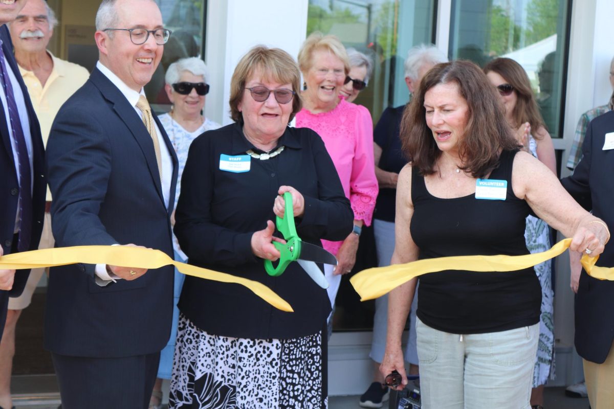 Town Manager Michael McCall (left), COA Director Julie Secord (middle) and Select Board Chair Susan Martin (right) stand together for the ribbon cutting, signifying the offical opening of the Community Center.