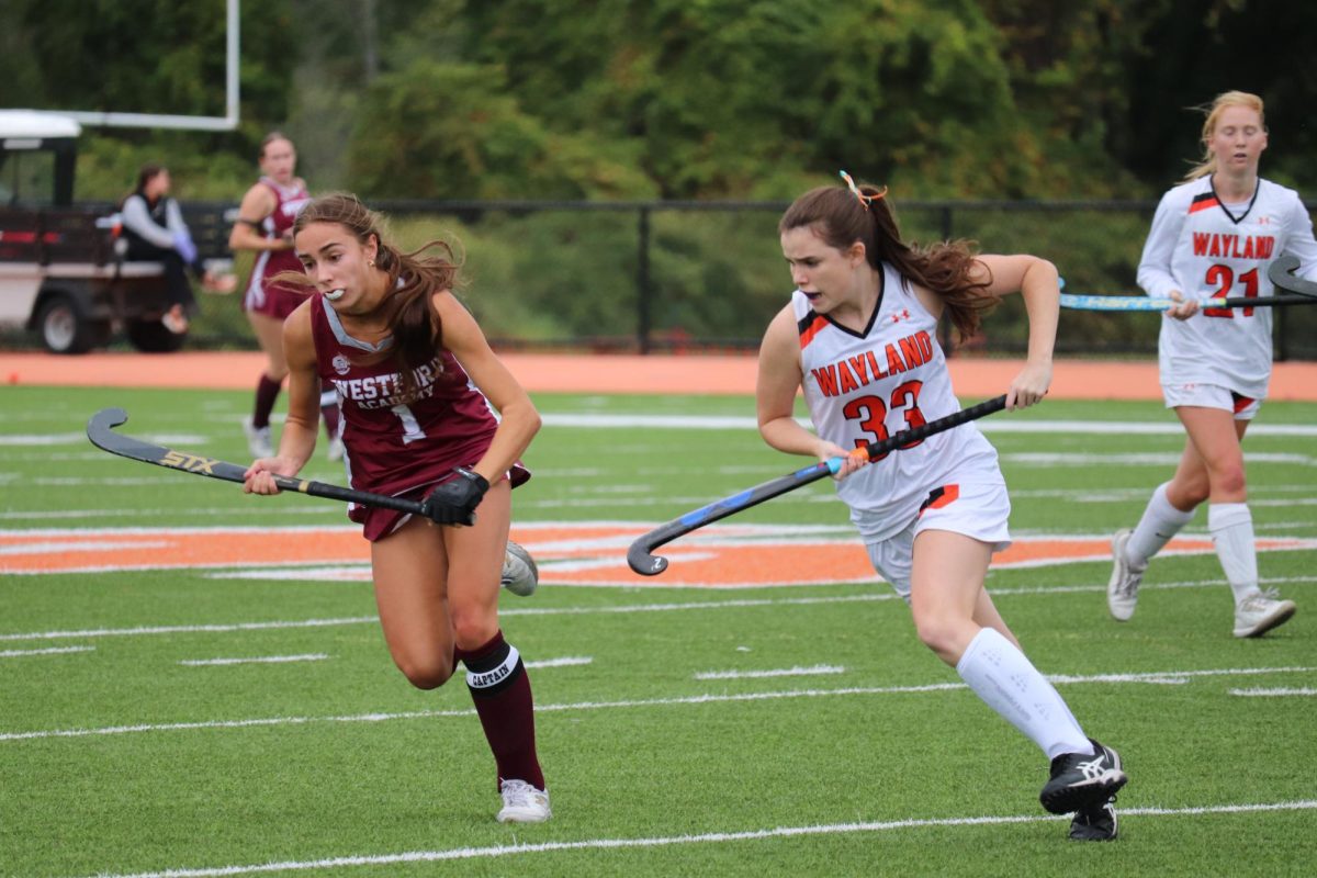Senior captain Kiera Hines drives down the field. The varsity field hockey team opens up their season on Friday, Sept. 5 with a home game against Arlington Catholic High School.
