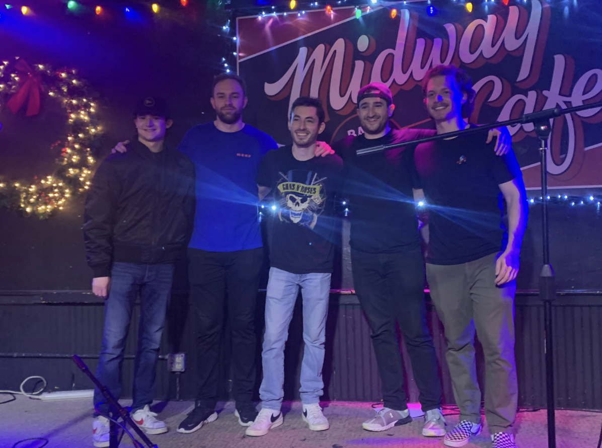 From left to right: Mike Bloom, Ryan Herlihy, Joshua Goodman, Matt Bloom and Jake Mitchell pose for a photo after a show. WHS teaching assistant Joshua Goodman is one of five members of the band 'Gold Rush.' 