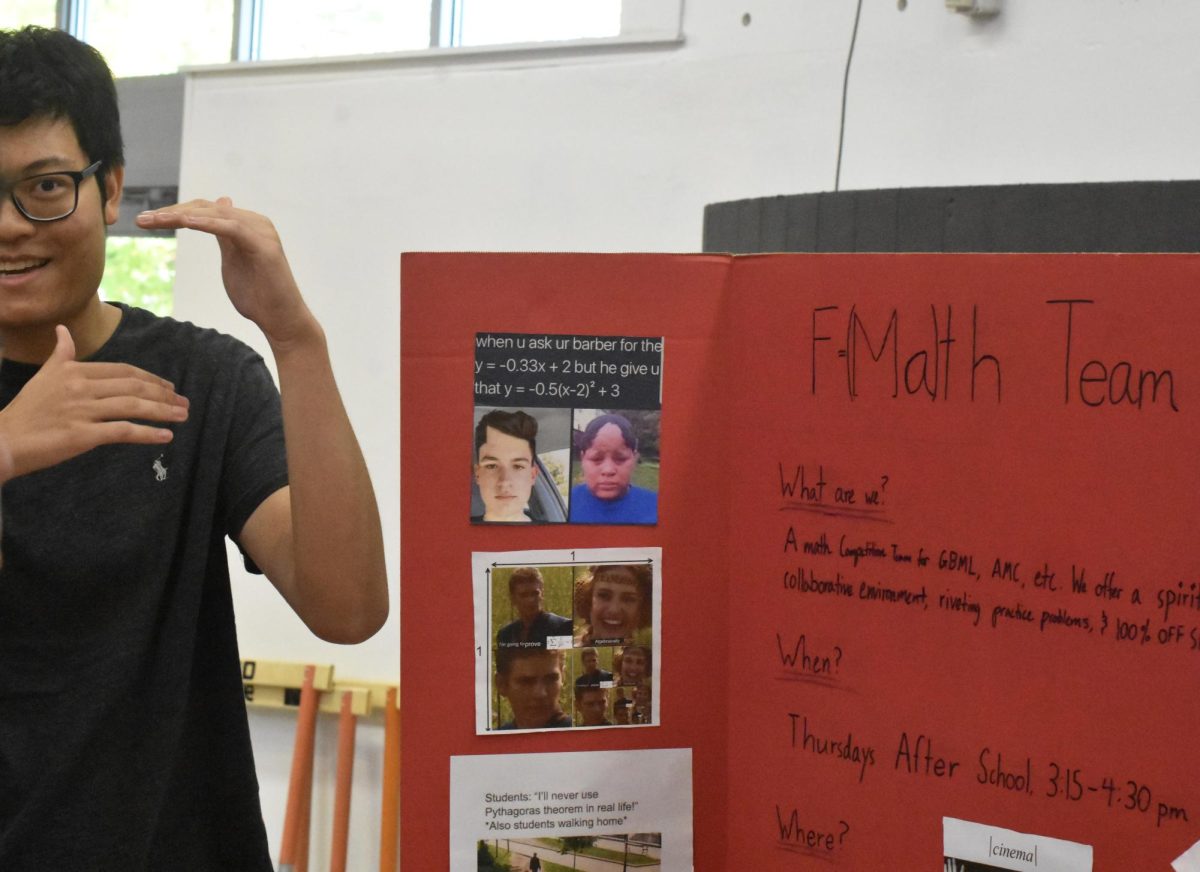 Senior Eric Zhang promotes his club, math team, to interested students. Wayland's prestigious math team has won multiple state titles and has made the New England podium before. "With all the science and STEM stuff, we're not just trying to fit in, we want to stand out and spread this opportunity to people who might be skilled at math but didn't know this existed," Zhang said.