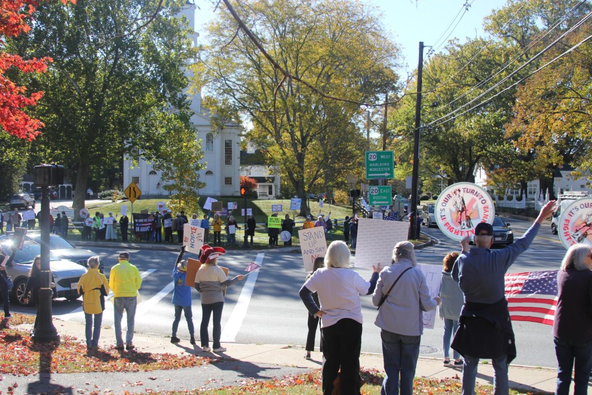 Protesters gather at Boston Post Road in Wayland for the No Kings protest. The protest took place from 9 a.m. to 12 p.m..
