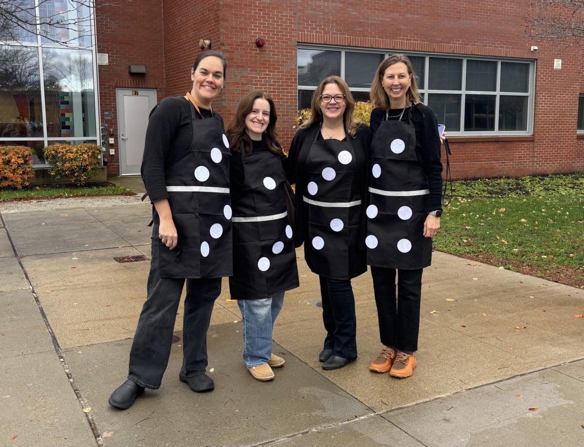 From left to right, teachers Veronique Latimer, Amy O'Connell, Rachel Carroll and Susan Memoli pose as dominoes to show off their Halloween spirit.