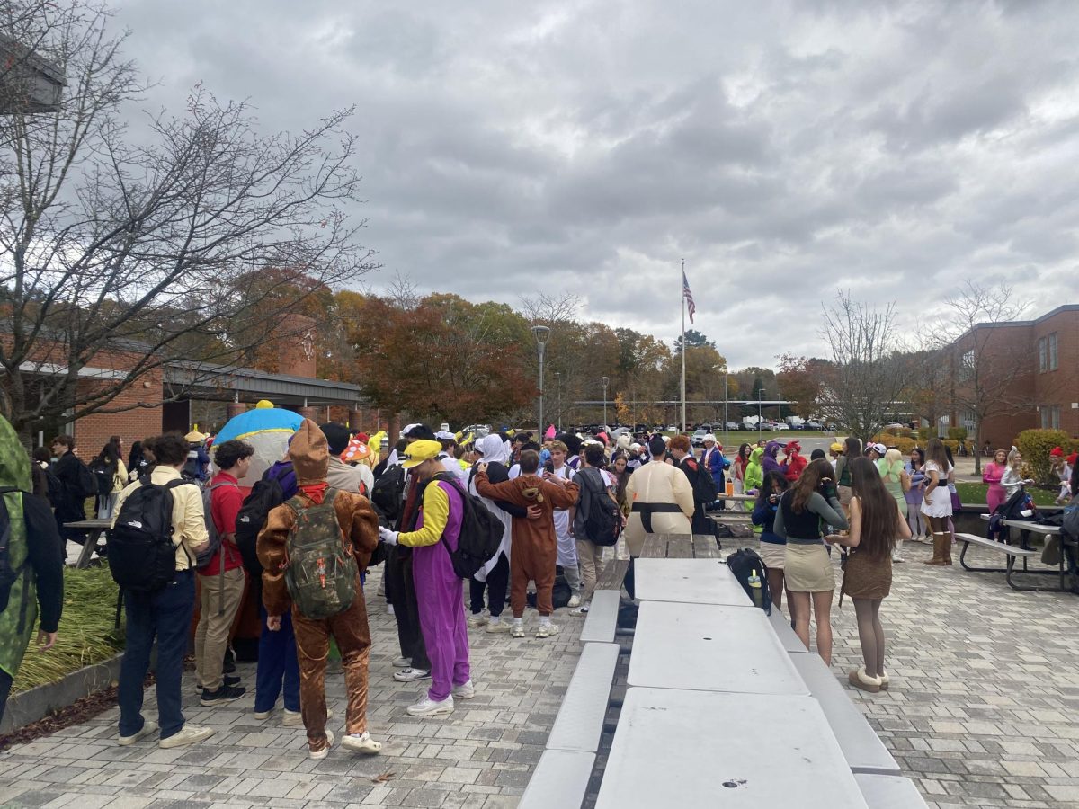 Seniors gather outside the commons for Monster Mash during Advisory. This Halloween celebration is a yearly tradition in which seniors dress up in creative costumes and take photos.