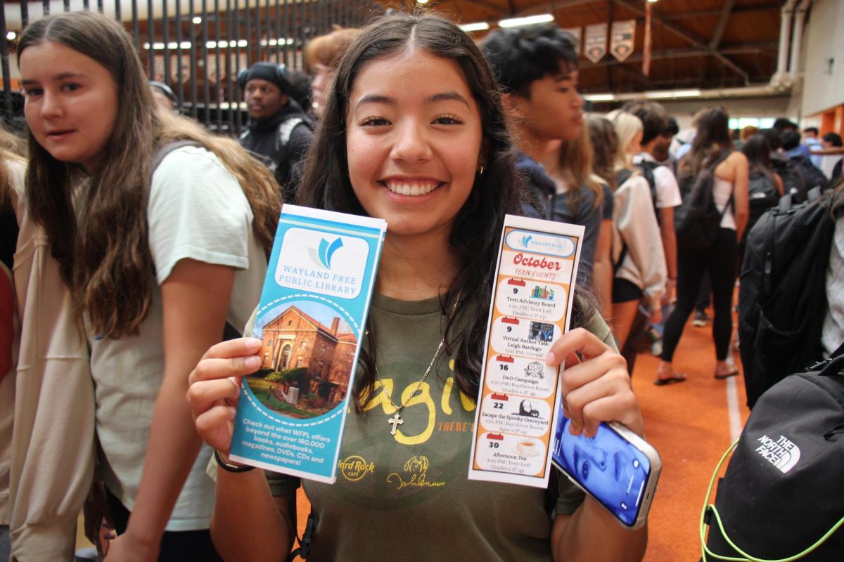 After visiting the Wayland Public Library stand, Sadie Estrada beams at the camera. "It was pretty nice to see how many clubs we have to offer and how diverse they are," said Estrada.