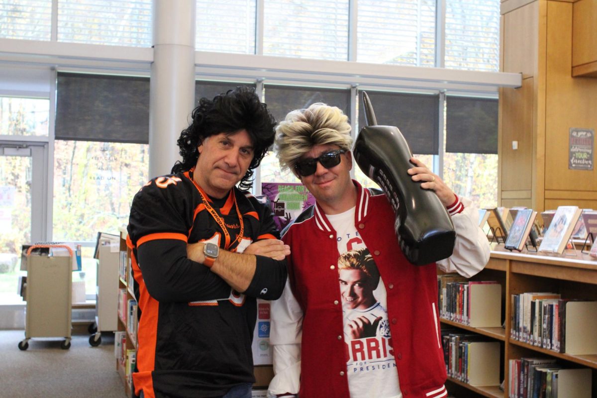 From left to right, WHS wellness teachers Scott Parseghian and Chris Fay dress up as characters from the 1990s hit show "Saved by The Bell".  With the rest of the department, "Saved by The Bell" characters strutted around the school blasting the show's theme song.