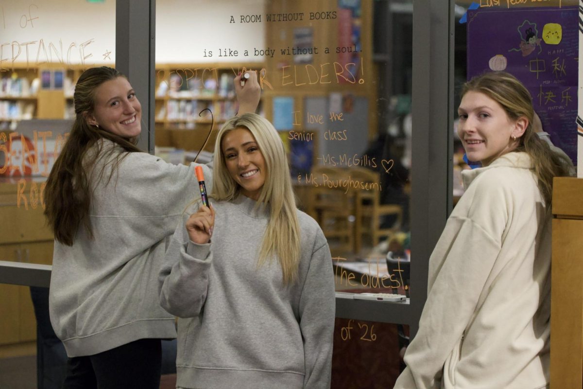 From left to right, seniors Annie Melander, Zoey Garcia and Mackenzie Morris pose for a picture.