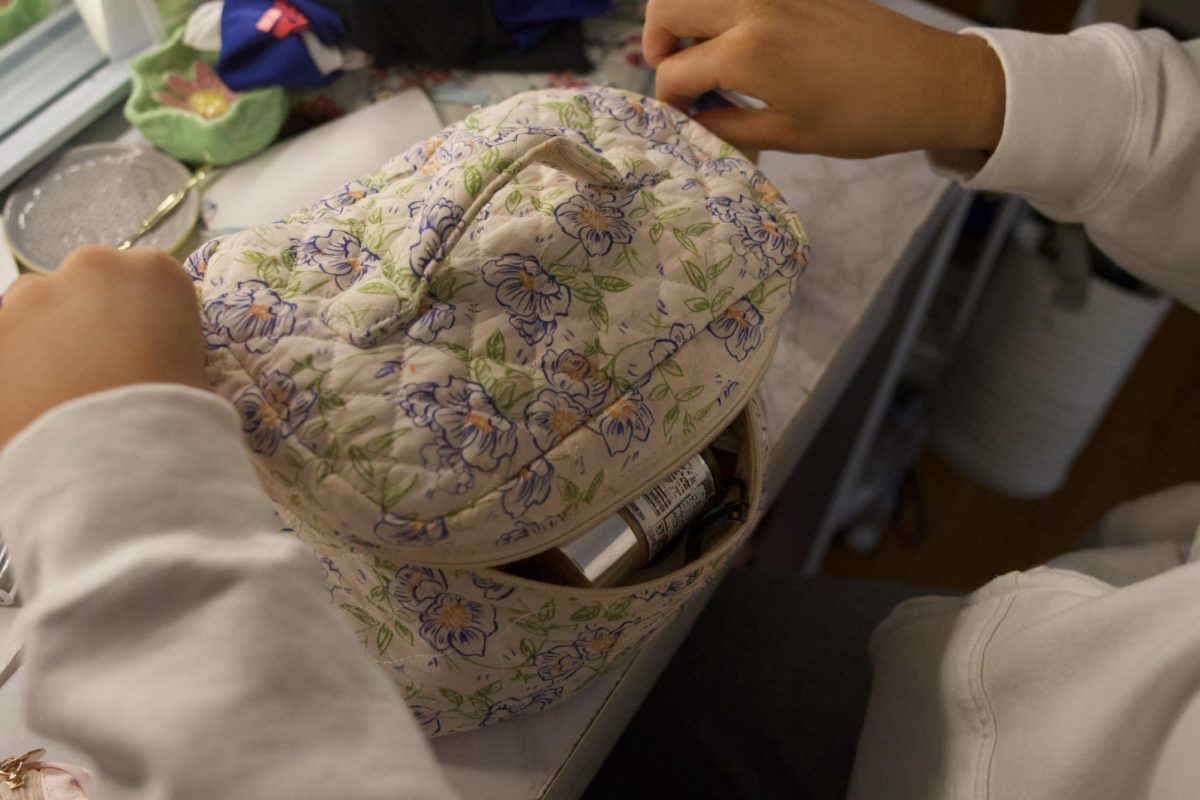 After senior Annie Melander does her base makeup, she starts packing up her bags, getting ready to leave.
