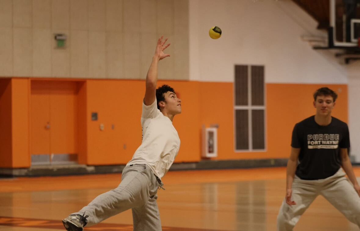 Senior Cole Zachary prepares to spike the ball onto the net. Zachary and senior Will Walters won the tournament, getting 50 points towards spirit week.
