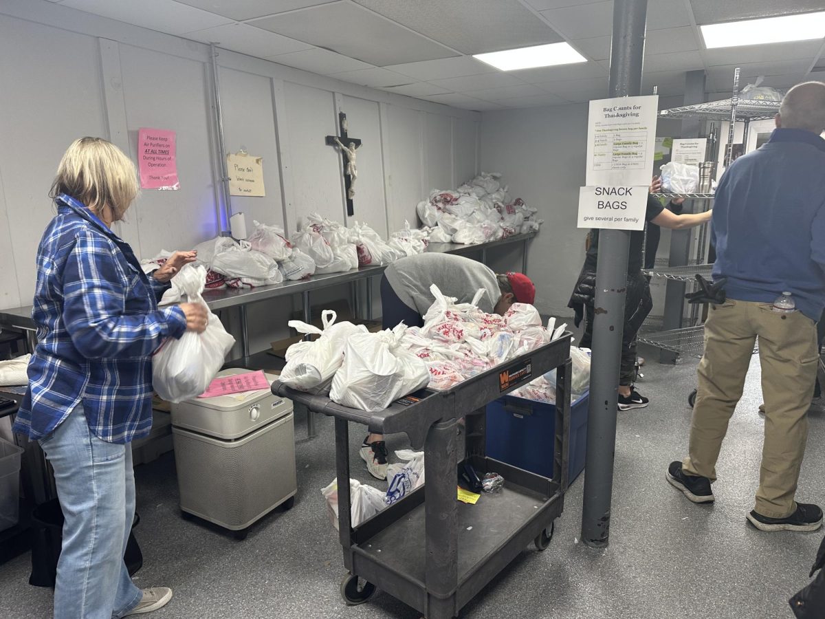 All Saints Parish volunteers organize the food drive in the basement of the All Saints Parish building in Haverhill.


