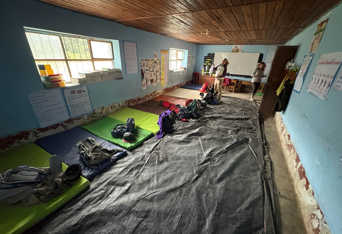 Using mats and their supplies from home, students slept on the floor of the school they visited in Chilchols.
