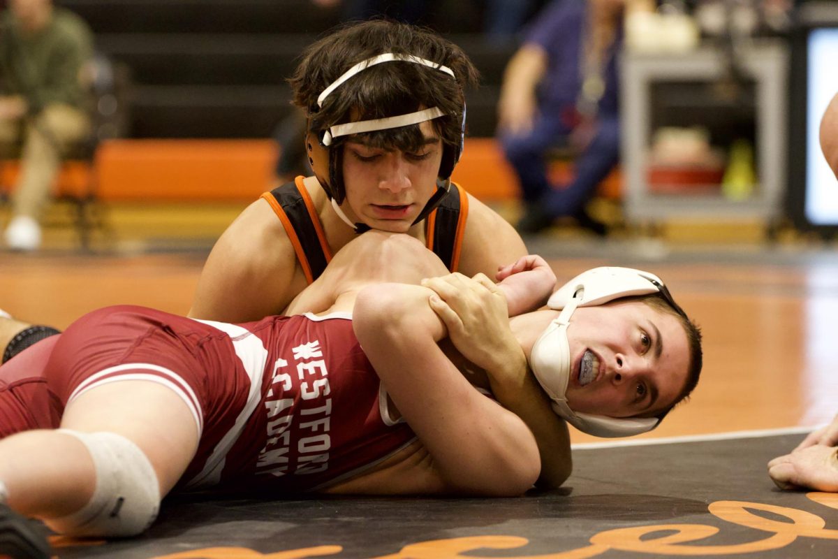 Junior Damian Sdoia half nelsons his opponent. This is Sdoia's second year on the team.