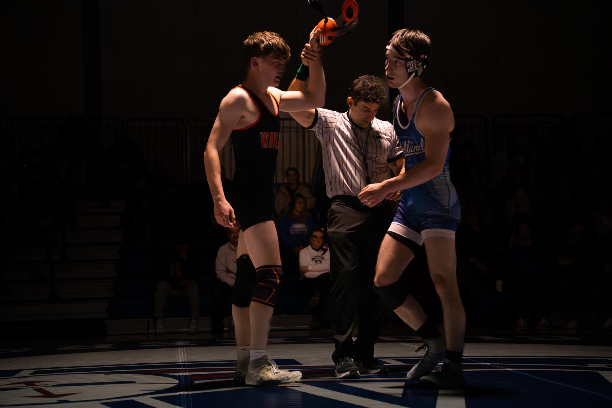 Senior captain Ronan Flatley has his arm raised in victory after defeating Ashland's Dean Lejeune in the 150-pound bout.