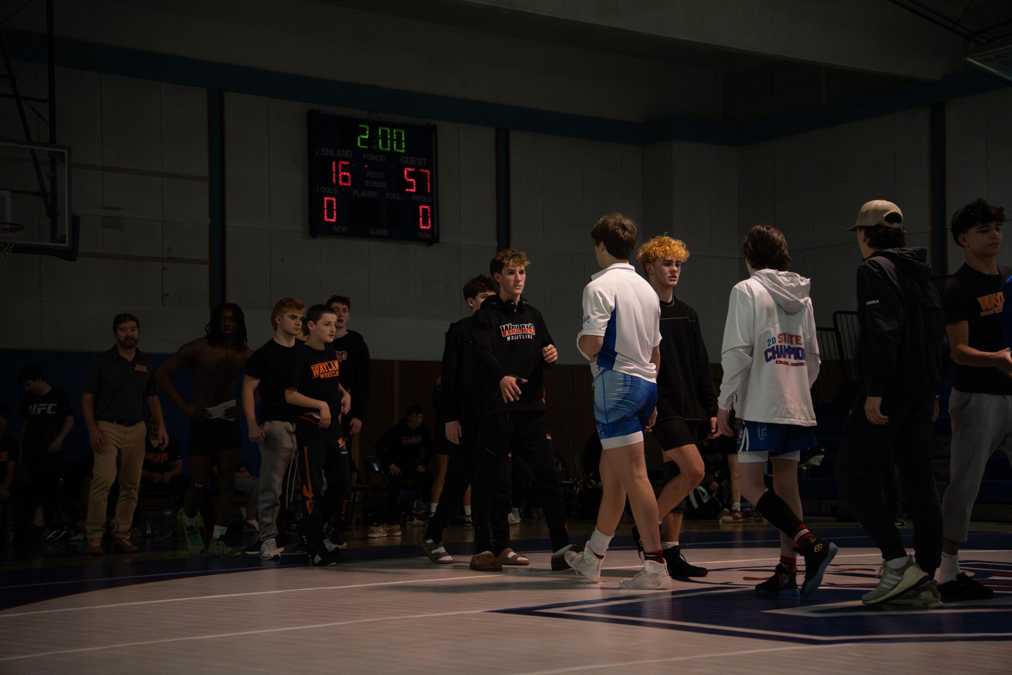 Following the meet, Wayland and Ashland wrestlers line up and shake hands.