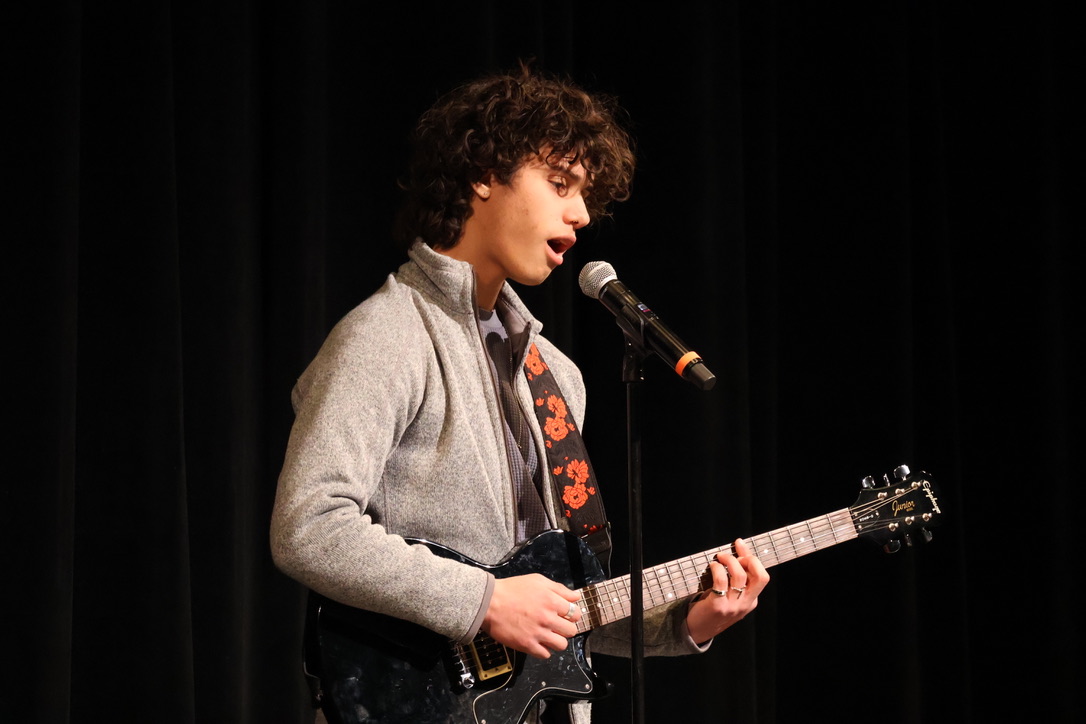 Sophomore Xavier Stewart harmonizes the lyrics to Jeff Buckley's Hallelujah. Stewart said that he was nervous when going onto stage, but it got easier as his musical abilities started to kick in. "Onced I opened my mouth, [I] started to get less nervous," Stewart said.