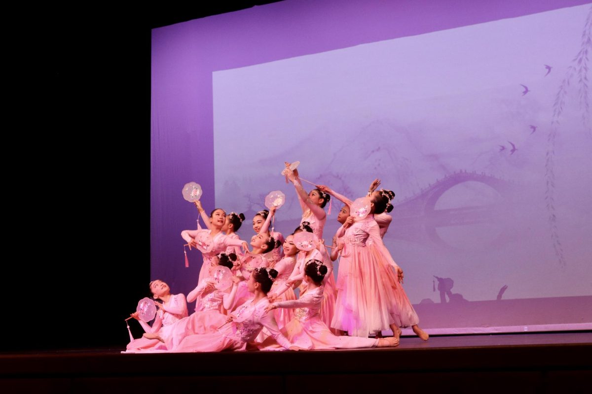 The Angel Performing Arts Elite C Team come together in a fluid pose to finish their dance, "Melody of Spring."