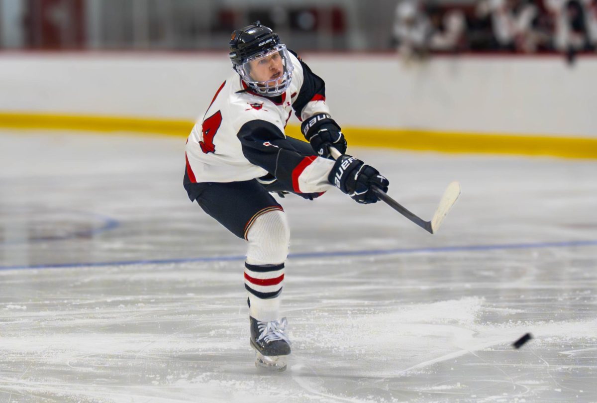 Junior Theo Henrich fires a shot on goal. "We just have to focus on getting our passing a little crisper for a better breakout in the defensive zone," Henrich said.
