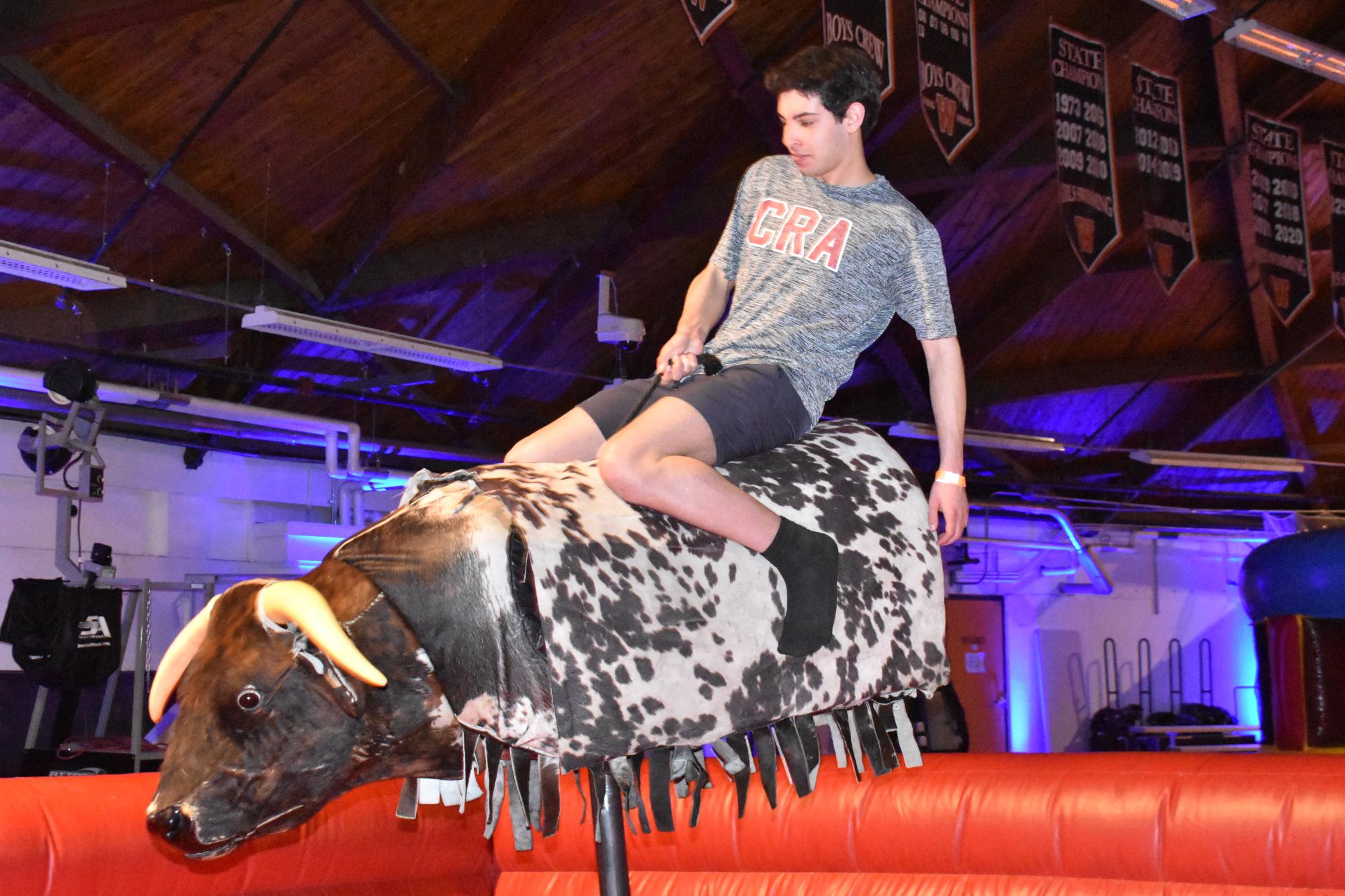 Junior John Doyle hangs on to the mechanical bull at Late Night.