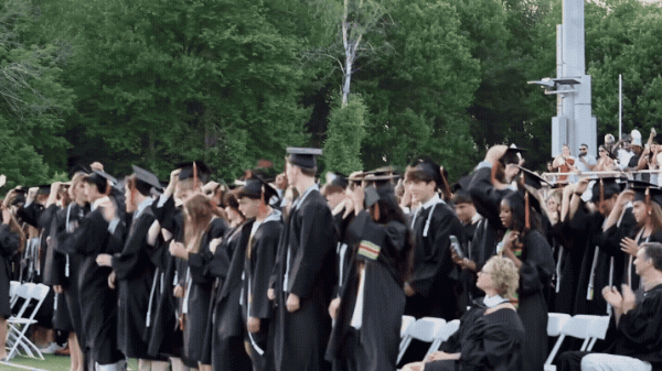 The Class of 2026 toss their caps into the air to conclude graduation.