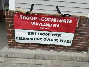 A Troop 1 Cochituate Wayland sign is posted at Stop and Shop, where Eagle Scout Matthew Tan ran a food drive. Troop 1 is one of the oldest Boy Scout troops in the nation.