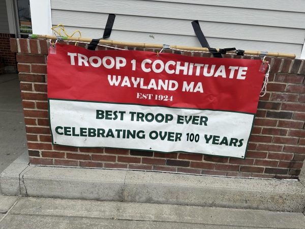 A Troop 1 Cochituate Wayland sign is posted at Stop and Shop, where Eagle Scout Matthew Tan ran a food drive. Troop 1 is one of the oldest Boy Scout troops in the nation.